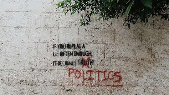 Photo of a graffiti that says If you repeat a lie often enough, it becomes politics
