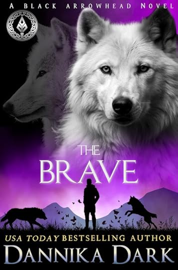 Mystical purple background with a large image of two wolves. Front-facing white wolf has a black left ear, and a faded wolf on the left giving a profile. Bottom silhouette depics a man standing between two wolves in a field of butterflies