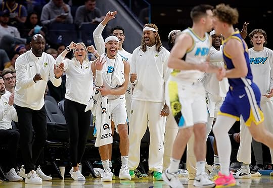 The Indiana Pacers bench celebrates a 3-point basket in the...