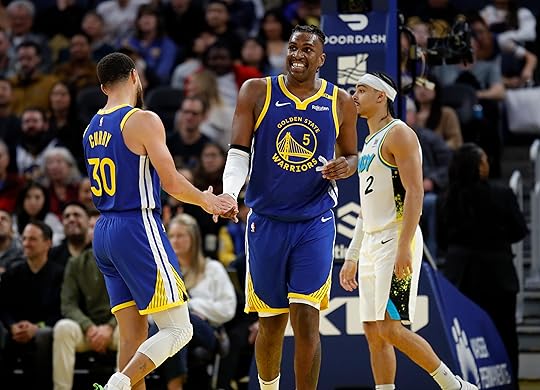 Golden State Warriors’ Kevon Looney #5 celebrates a basket with...