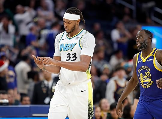 Indiana Pacers’ Myles Turner #33 counts the 3-point basket he...