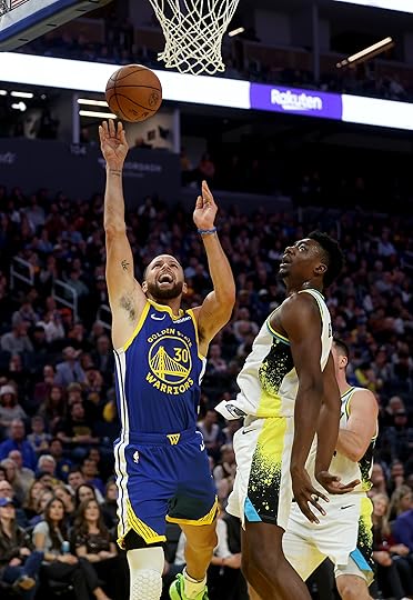 Golden State Warriors’ Stephen Curry #30 shoots an off-balance layup...