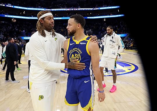 Golden State Warriors’ Stephen Curry #30 is greeted by Indiana...