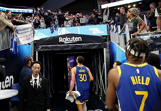 Golden State Warriors’ Stephen Curry #30 is greeted and Golden...