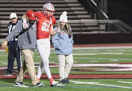 The Carmel medical staff assists Ashton Rees off the field after Rees suffered a sprained toe in the second quarter of Friday's Northern California Division 5AA title game. Rees scored four touchdowns on the night in the Padres' 42-41 win over Acalanes. (Donald Fukui -- Herald Correspondent)
