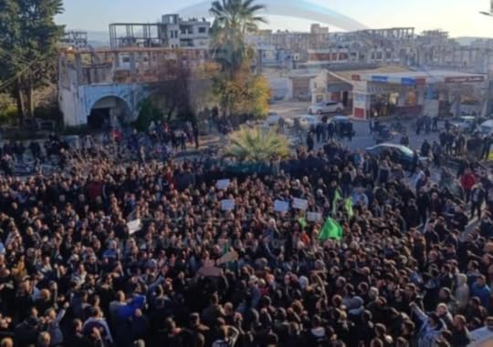 An angry protest can be seen in Qardaha, Assad’s hometown after a video circulated showing an attack on an Alawite shrine in Syria’s north. (@syriahr)
