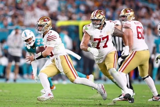 Brock Purdy #13 of the San Francisco 49ers runs the ball during the third quarter against the Miami Dolphins at Hard Rock Stadium on Dec. 22, 2024 in Miami Gardens, Florida. (Photo by Megan Briggs/Getty Images)