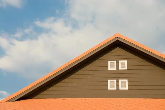 Brown house with orange roof trim