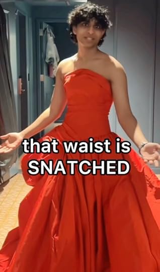 This may contain: a woman in an orange dress with the caption that waist is snatched