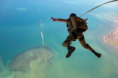 Air Force personnel jump out of an HC-130J Combat King II during training over Djibouti on May 9. Photo by Staff Sgt. Aaron Irvin, courtesy of the U.S. Air Force.