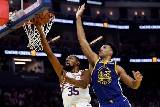Golden State Warriors' Trayce Jackson-Davis blocks a shot by Phoenix Suns' Kevin Durant in the first quarter, Saturday, Dec. 28, 2024, at Chase Center in San Francisco, Calif. (Karl Mondon/Bay Area News Group)