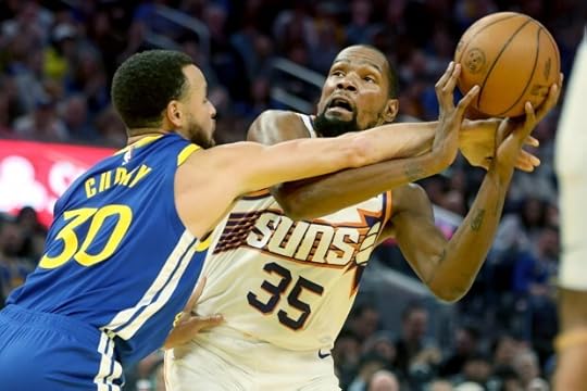 Golden State Warriors' Stephen Curry fouls Phoenix Suns' Kevin Durant in the first quarter, Saturday, Dec. 28, 2024, at Chase Center in San Francisco, Calif. (Karl Mondon/Bay Area News Group)