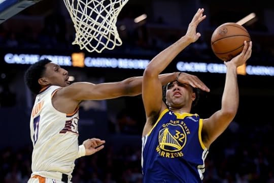 Golden State Warriors' Trayce Jackson- Davis is fouled by Phoenix Suns' Ryan Dunn, Saturday, Dec. 28, 2024, at Chase Center in San Francisco, Calif. (Karl Mondon/Bay Area News Group)