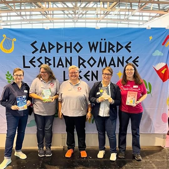 Clare Lydon and Chris Zett and Astrid Ohletz and Harper Bliss and Jae posing on the Frankfurt Book Fair 2024