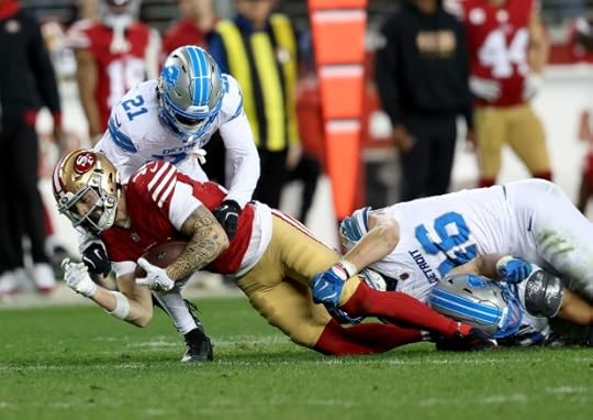 San Francisco 49ers' Ricky Pearsall #14 is tackled by Detroit Lions' Amik Robertson #21 and Jack Campbell #46 in the fourth quarter of their NFL game at Levis Stadium in Santa Clara, Calif., on Monday, Dec. 30, 2024. (Jane Tyska/Bay Area News Group)