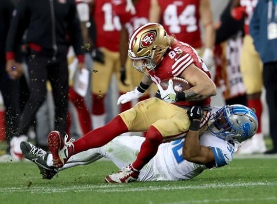San Francisco 49ers' George Kittle #85 is tackled by Detroit Lions' Brian Branch #32 in the third quarter of their NFL game at Levis Stadium in Santa Clara, Calif., on Monday, Dec. 30, 2024. (Jane Tyska/Bay Area News Group)