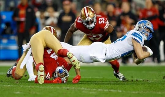 Detroit Lions' Sam LaPorta (87) dives forwards for a first down against San Francisco 49ers' Deommodore Lenoir (2) and San Francisco 49ers' Dee Winters (53) in the second quarter at Levi's Stadium in Santa Clara, Calif., on Monday, Dec. 30, 2024. (Nhat V. Meyer/Bay Area News Group)