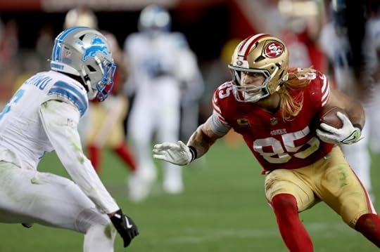 San Francisco 49ers' George Kittle #85 gains yardage as Detroit Lions' Ifeatu Melifonwu #6 closes in on defense in the fourth quarter of their NFL game at Levis Stadium in Santa Clara, Calif., on Monday, Dec. 30, 2024. (Jane Tyska/Bay Area News Group)