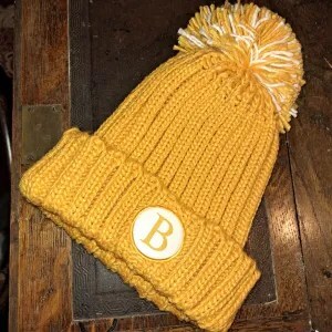 photo of orange bobble hat featuring B for Boldwood logo