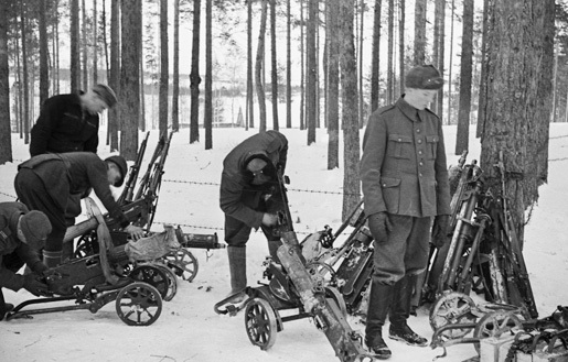 Finnish troops gathering captured Soviet weapons, Taipale, Finland, 27-28 Dec 1939 (public domain via Wikipedia) 
