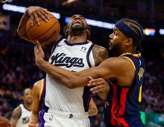 Golden State Warriors' Moses Moody (4) fights for the ball against Sacramento Kings' Malik Monk (0) in the third quarter at the Chase Center in San Francisco, Calif., on Sunday, Jan. 5, 2025. (Nhat V. Meyer/Bay Area News Group)