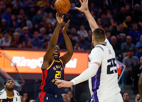 Golden State Warriors’ Draymond Green (23) scores a 3-point basket...