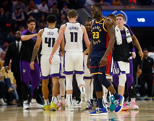 Golden State Warriors’ Draymond Green (23) heads to the bench...