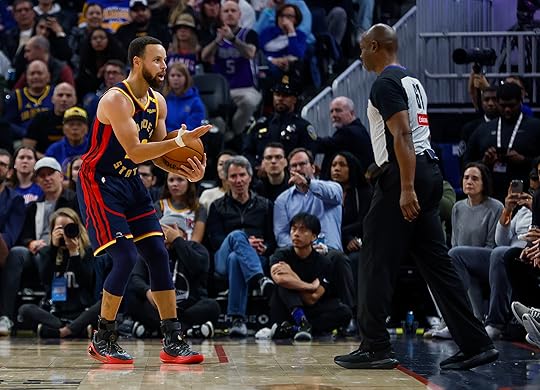 Golden State Warriors’ Stephen Curry (30) argues a call with...