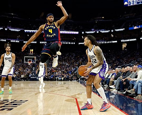 Golden State Warriors’ Moses Moody (4) attempts to block a...