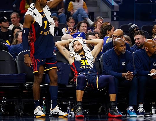 Golden State Warriors’ Stephen Curry (30) sits on the bench...