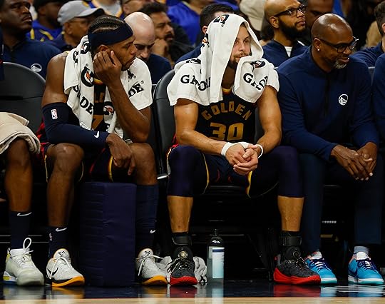 Golden State Warriors’ Stephen Curry (30) sits on the bench...