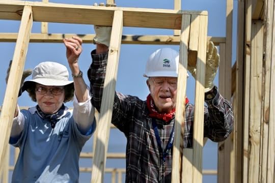 Former President Jimmy Carter, right, and former first lady Rosalynn Carter help build a Habitat for Humanity house in Violet, La.