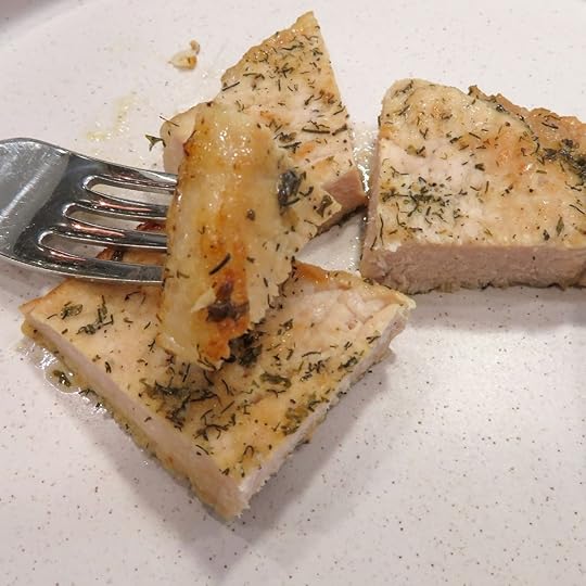 Ranch baked pork chop on a fork