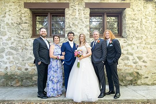 family picture at our son's wedding showing how our family grew