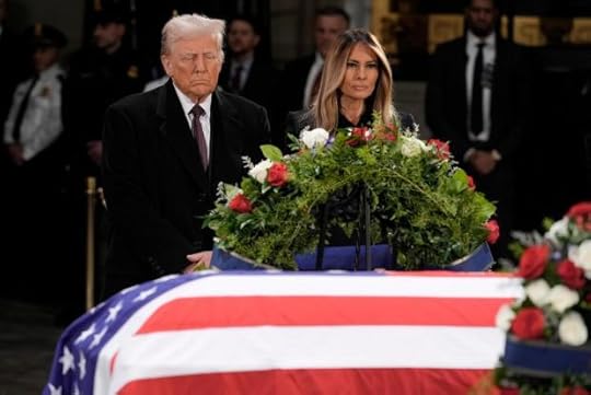 President-elect Donald Trump and Melania Trump pause at the flag-draped casket of former President Jimmy Carter