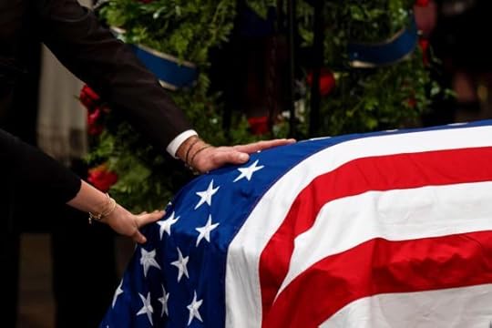 The Carter family pay their respects during a ceremony as the flag-draped casket of former President Jimmy Carter lies in state, at the Capitol.
