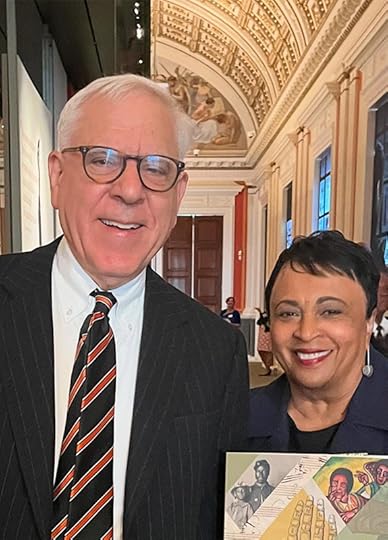 Quarter-length portrait of David Rubenstein and Carla Hayden at the Treasures Gallery opening.