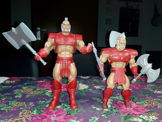 Masters of the Universe Classics and Origins Geldor action figure side by side.
