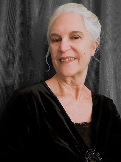 Smiling woman with white hair, author Jeanne Gehret