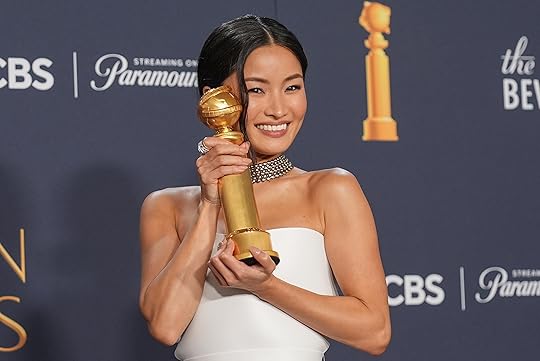 Anna Sawai poses in the press room with the award...
