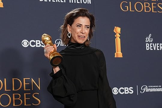 Fernanda Torres poses in the press room with the award...
