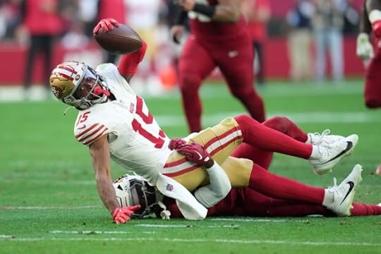 San Francisco 49ers wide receiver Jauan Jennings (15) is tackled by Arizona Cardinals cornerback Garrett Williams (21) during the first half of an NFL football game in Glendale, Ariz., Sunday, Jan. 5, 2025. (AP Photo/Ross D. Franklin)