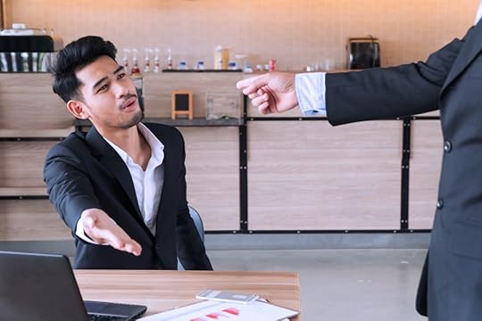 Colleagues pointing the finger of blame at each other.