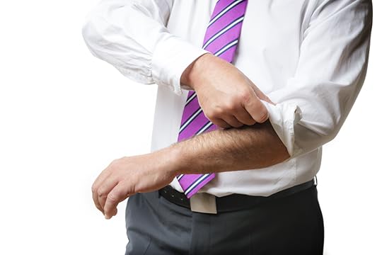 Person rolling up their sleeves