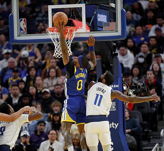 Golden State Warriors’ Gary Payton II #0 dunks past Dallas...