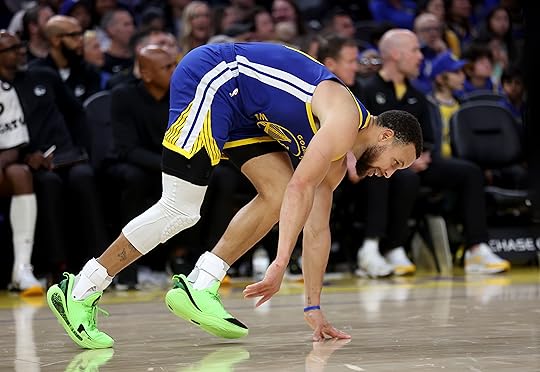 Golden State Warriors’ Stephen Curry #30 gets up from the...