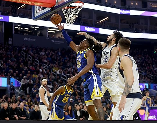 Golden State Warriors’ Kevon Looney #5 shoots a layup past...