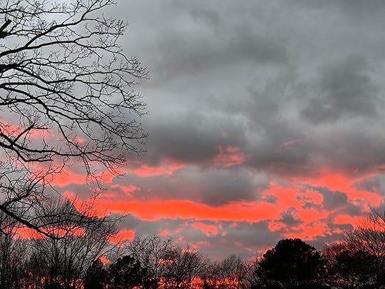 a sunset with clouds in the sky