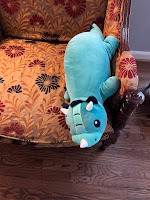 Teal colored dinosaur with a little frill and horns.