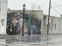Mural of an interracial couple with a baby